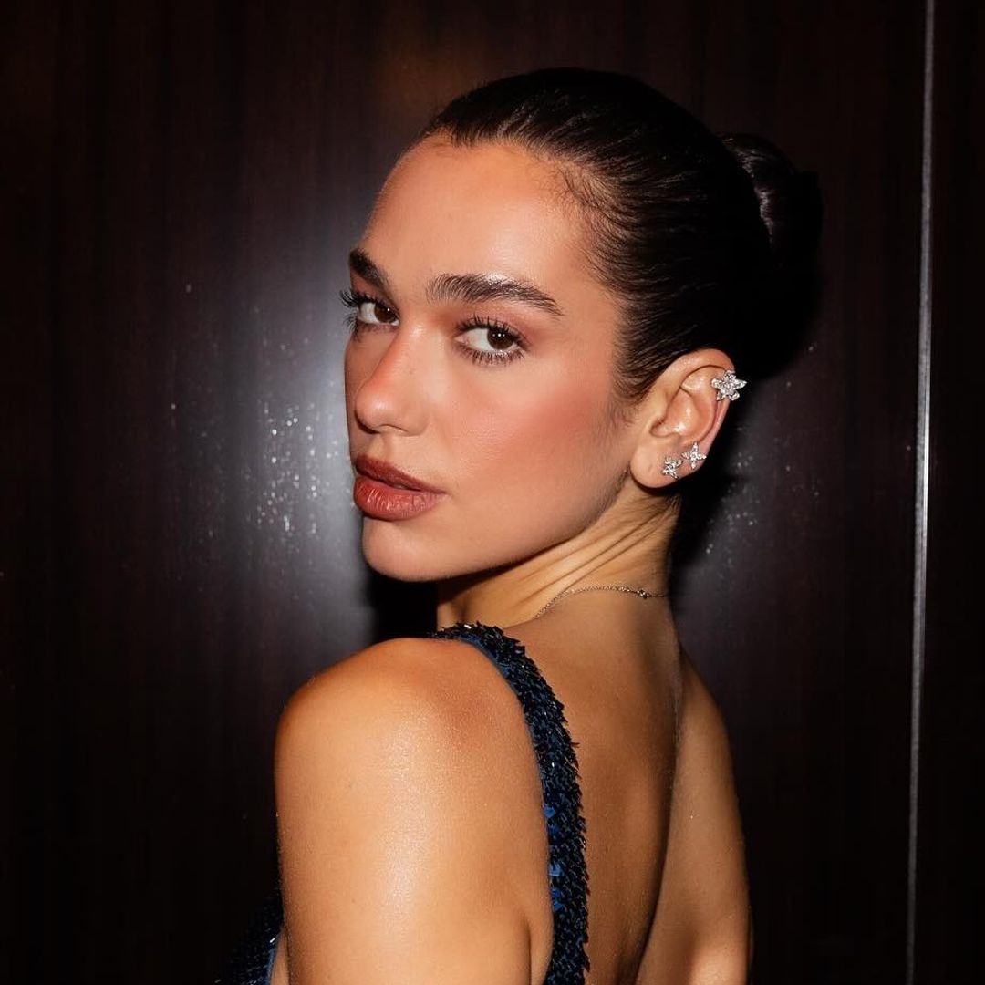Dua Lipa sports a sheer plunging animal print dress to debut new hair transformation