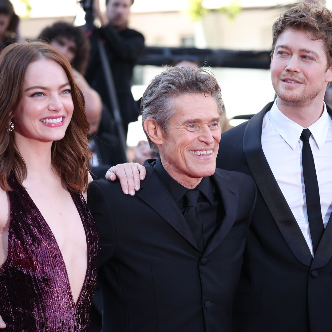 Emma Stone and Margaret Qualley are all smiles as they pose with Joe Alwyn at Cannes