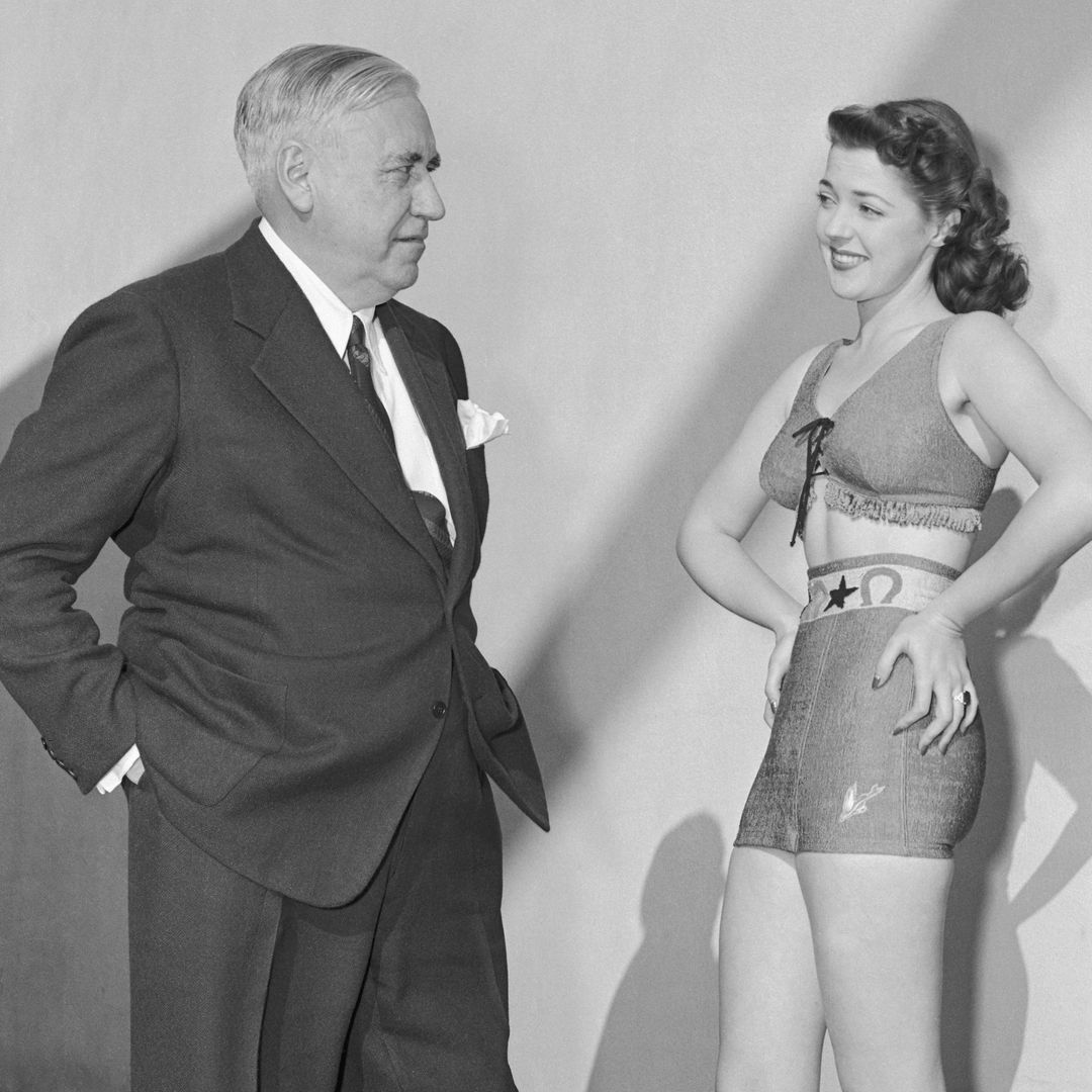 The man who invented the Bathing Beauty Mack Sennett is shown with the Mack Sennett Bathing Beauty for 1942. She is Anne Gwynne and you'll admit that the judges sure picked a peach this time.