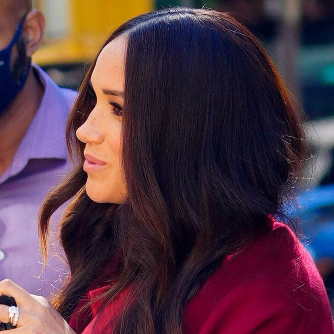 Meghan Markle stuns in scarlet outfit during school visit with Prince Harry