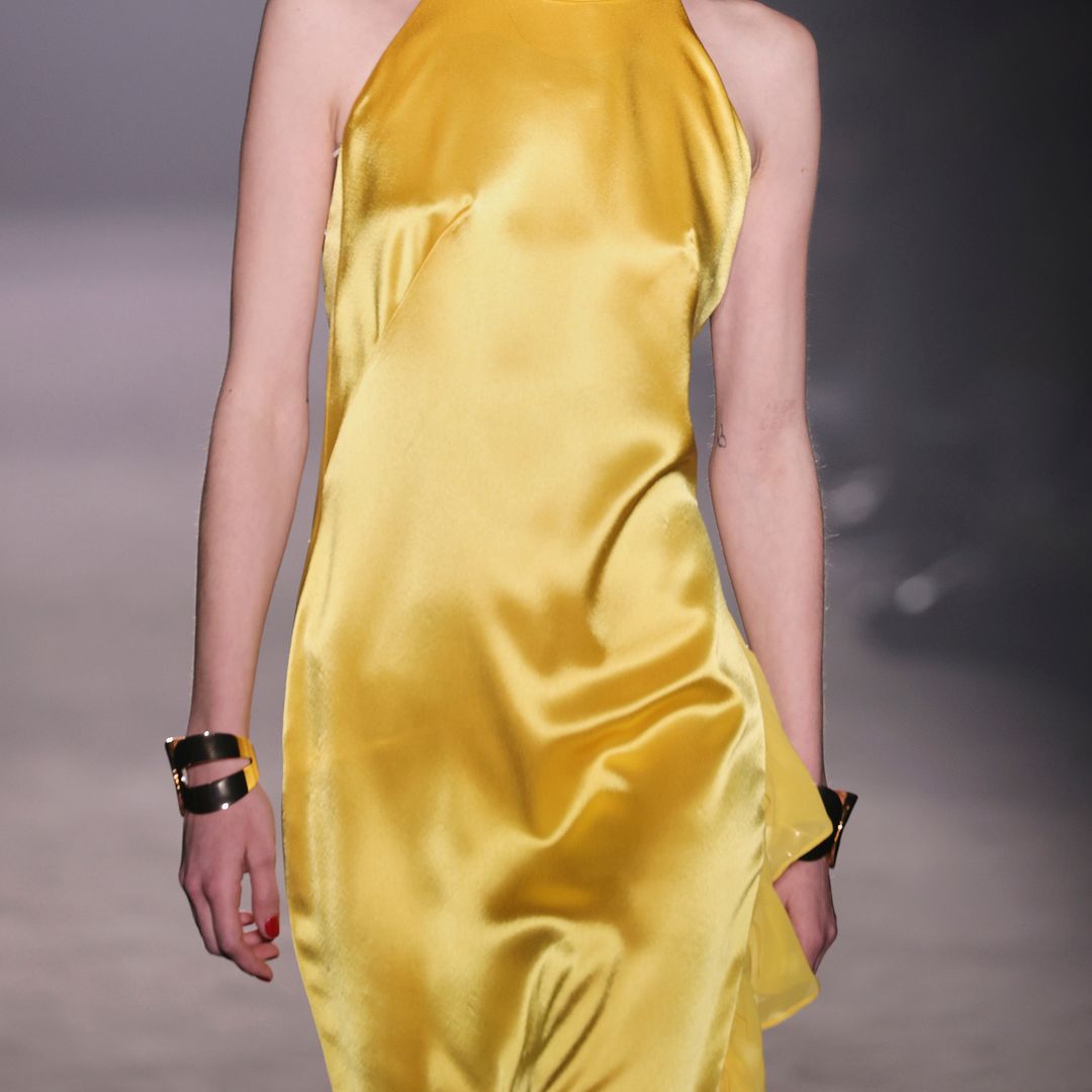 Golden cuffs with matching silk dresses at Menchen Tomas