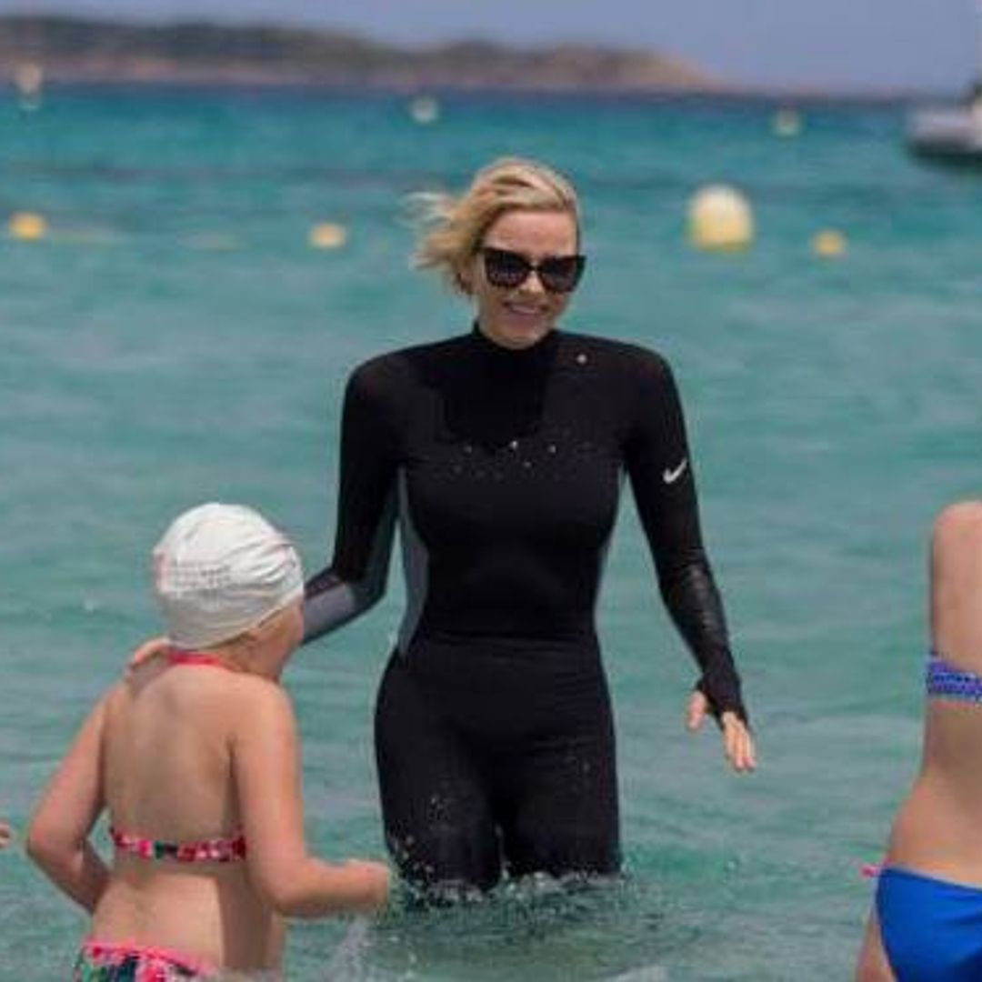 Princess Charlene wears a wetsuit for charity water safety event