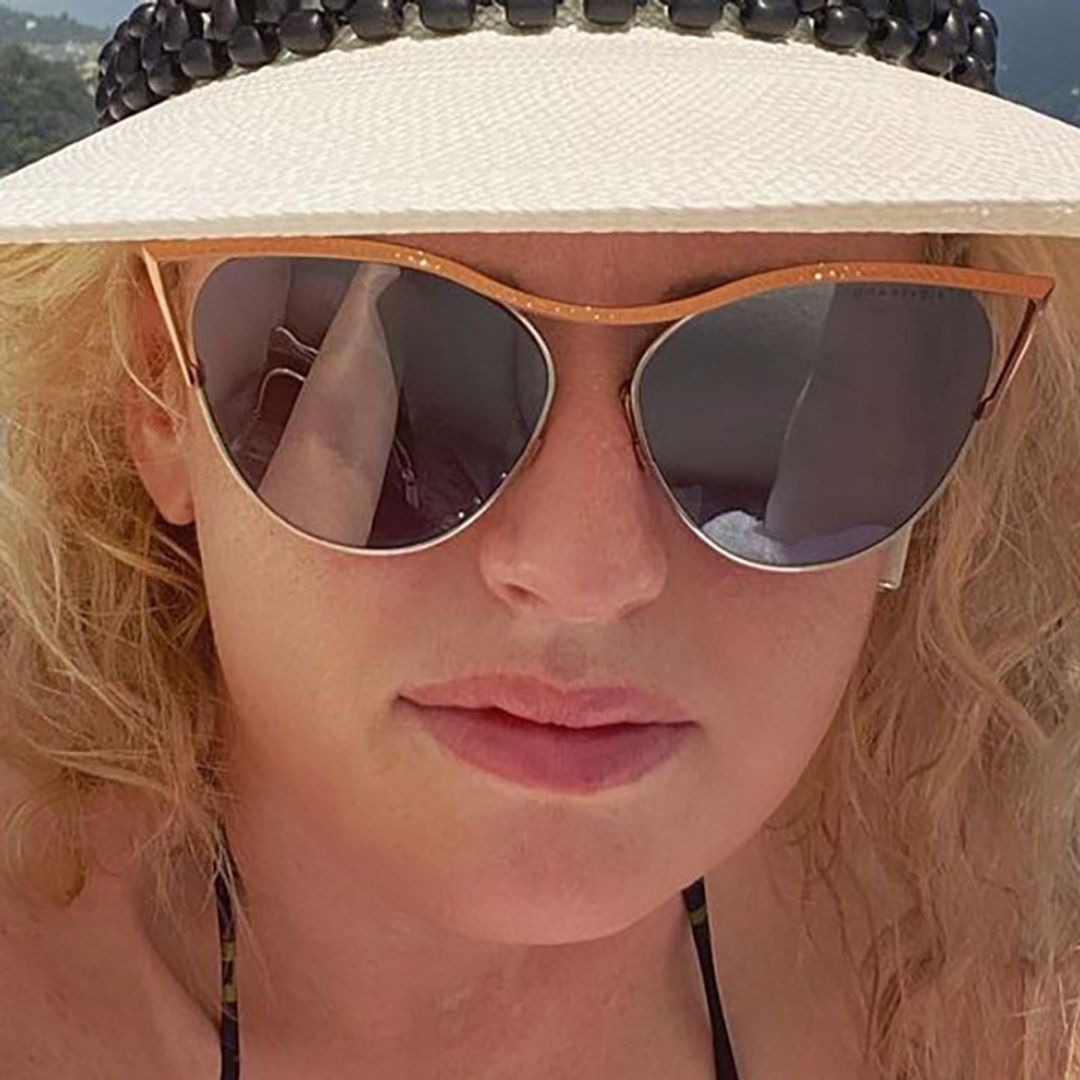 Rebel Wilson showered with praise after sharing plunging red hot swimsuit snap from beach holiday