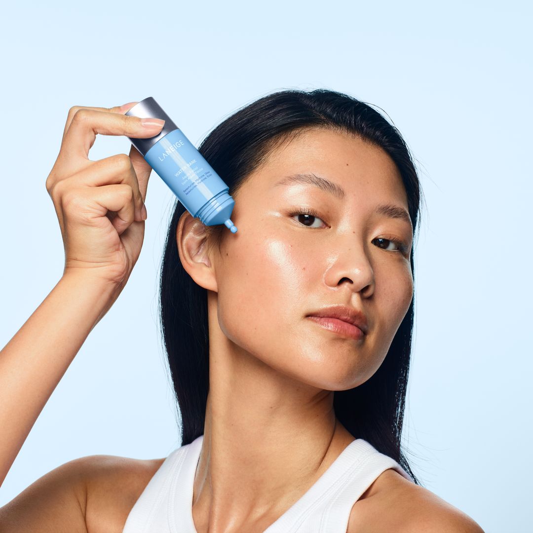 a woman applying skincare 