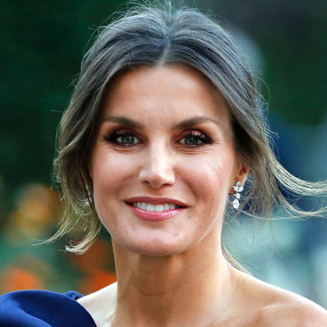 Queen Letizia dazzles royal fans in waist-cinching dress for family outing