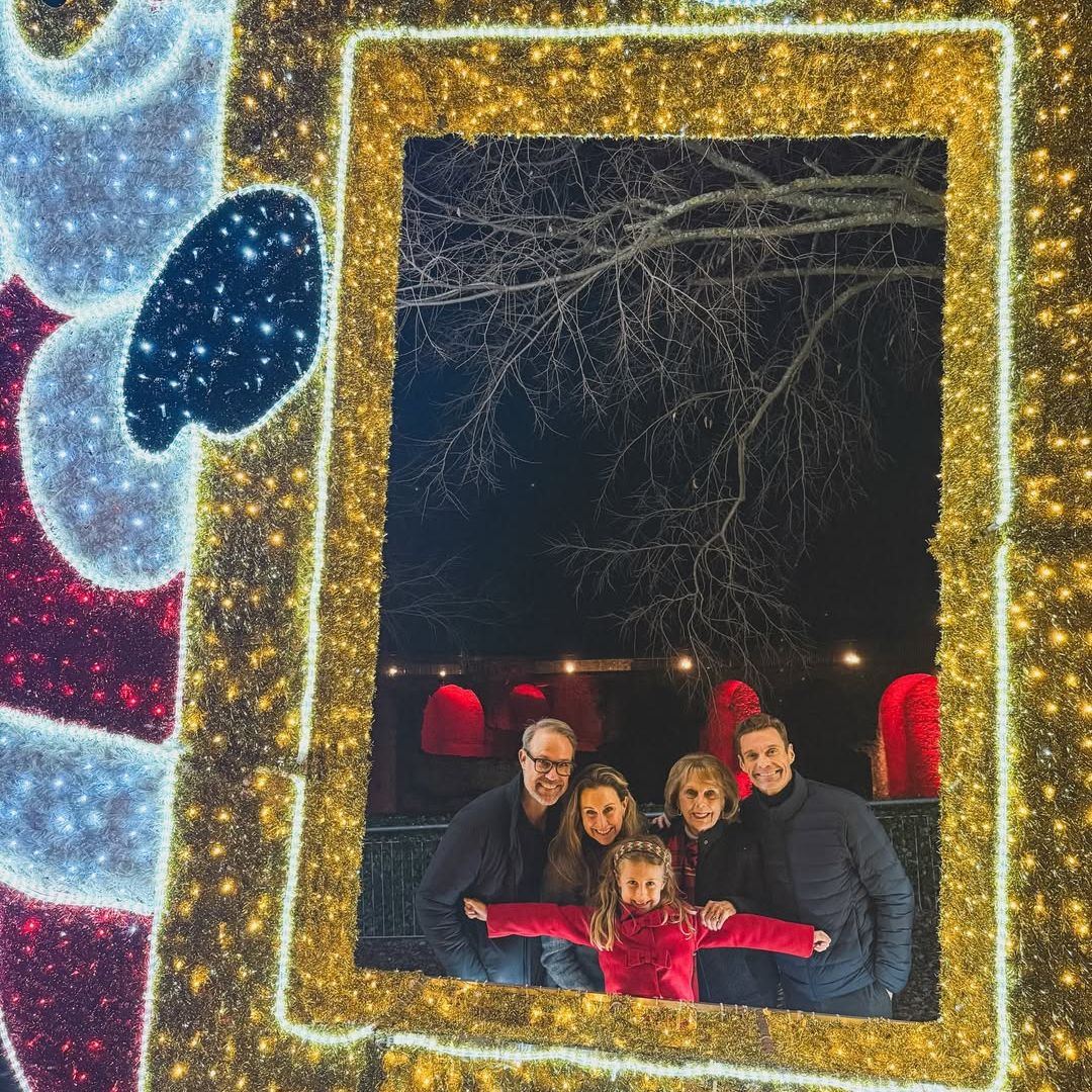 Ryan Seacrest and his family, including mother Connie, sister Meredith, her husband Jimmy, and their daughter Flora, pose for a photo at a holiday display, shared on Instagram