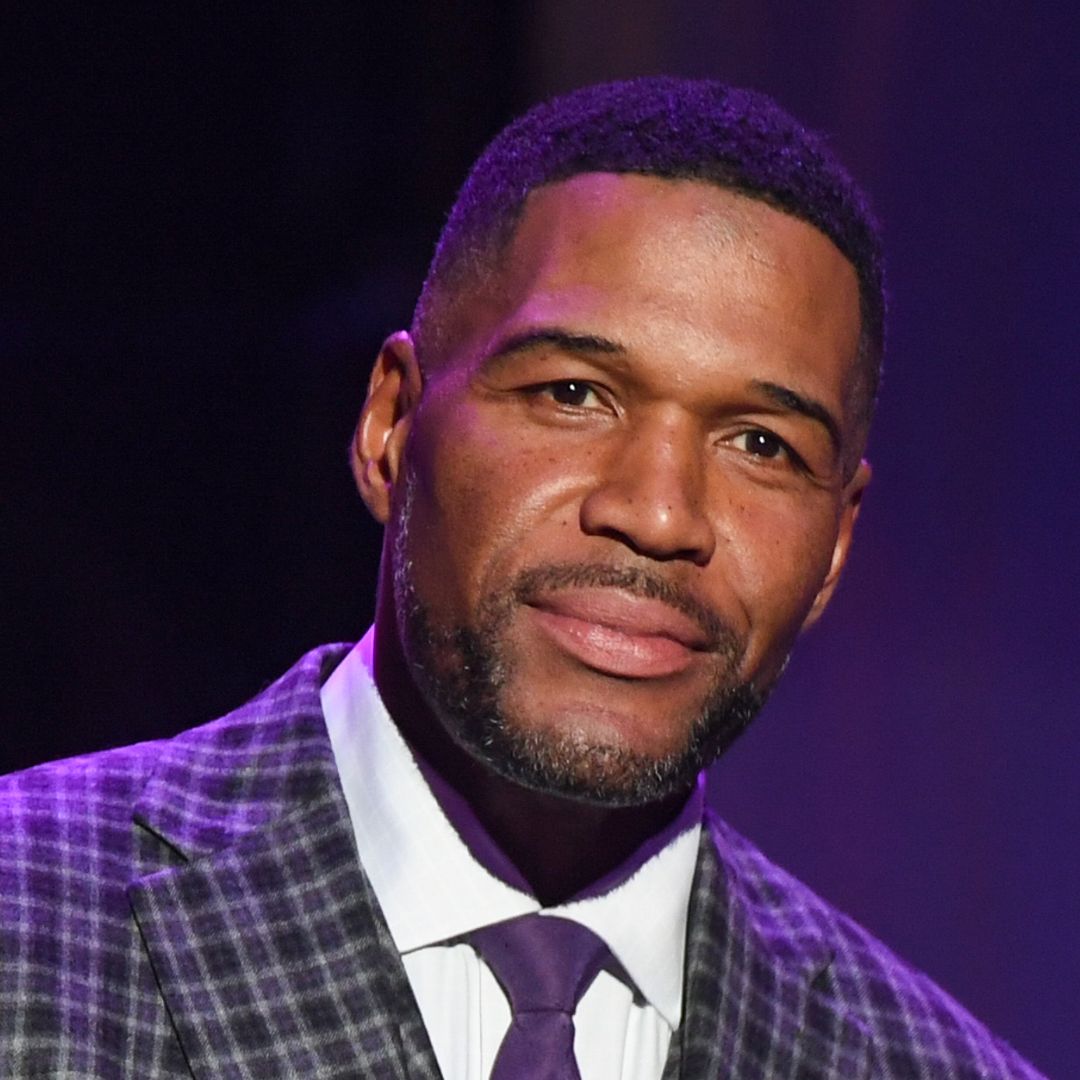 Michael Strahan gets hit in the face by football live on air