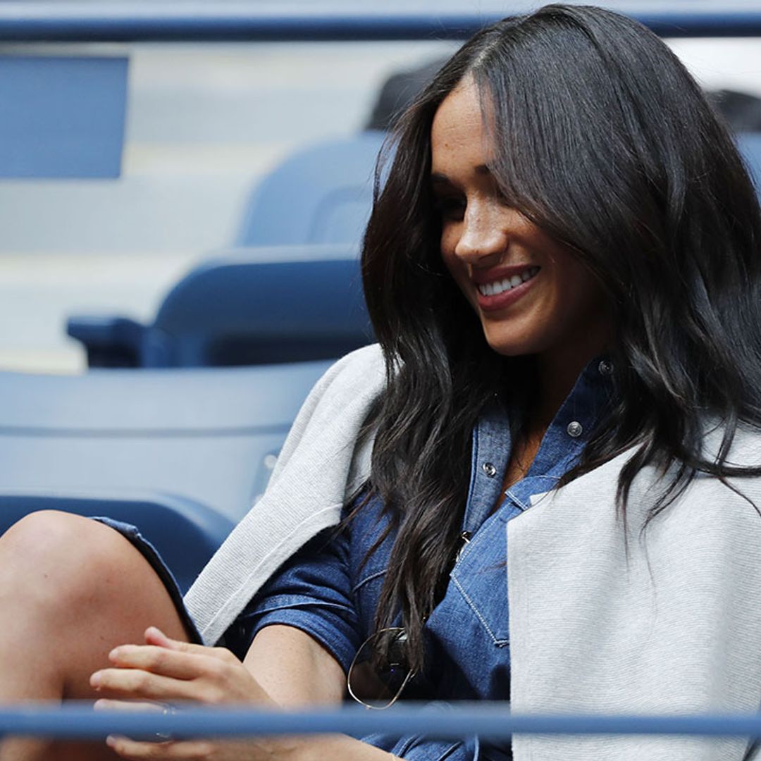 Meghan Markle stuns at US Open, wearing a belted navy denim dress with a sleek cardigan