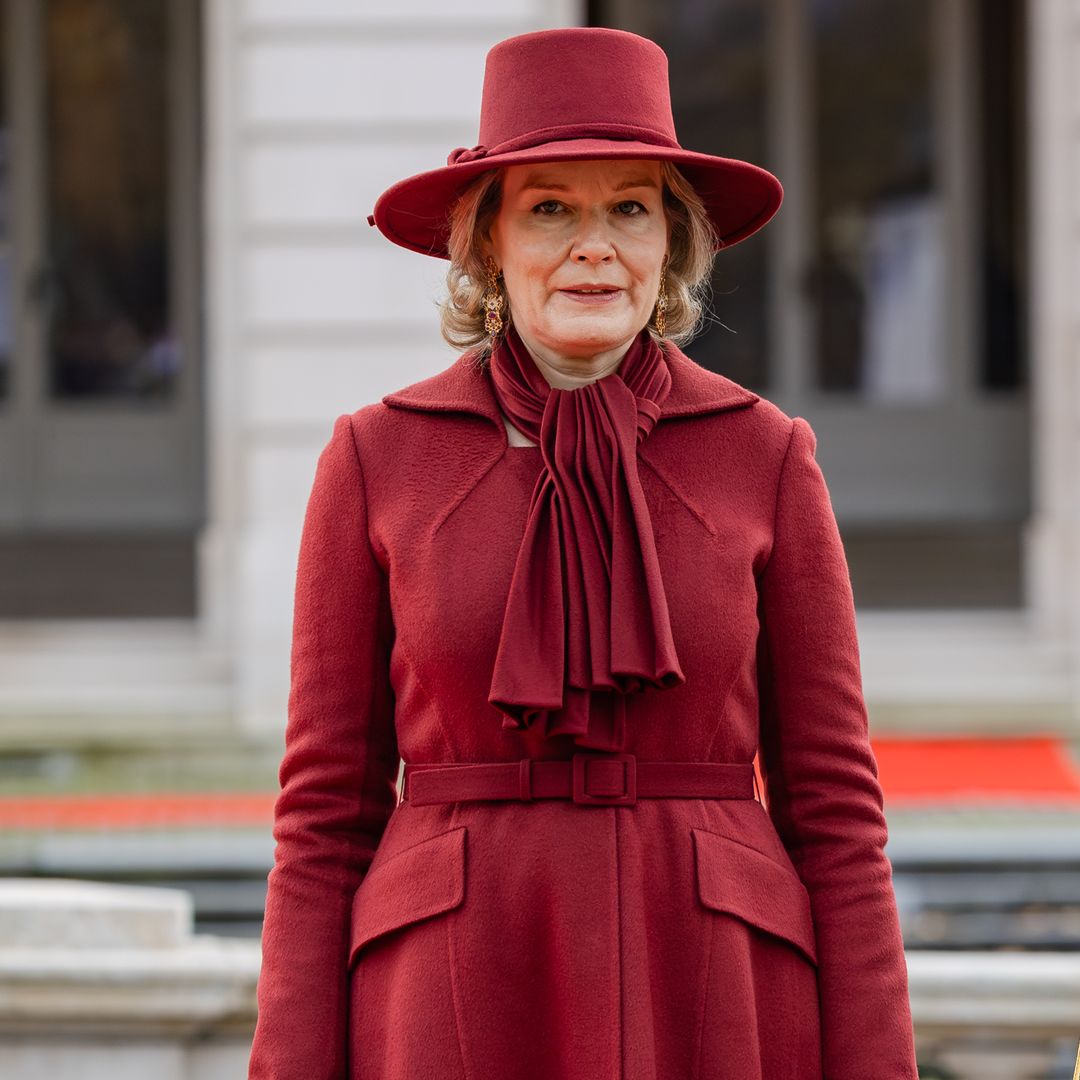 Queen Mathilde stuns in red hot coat and killer heels