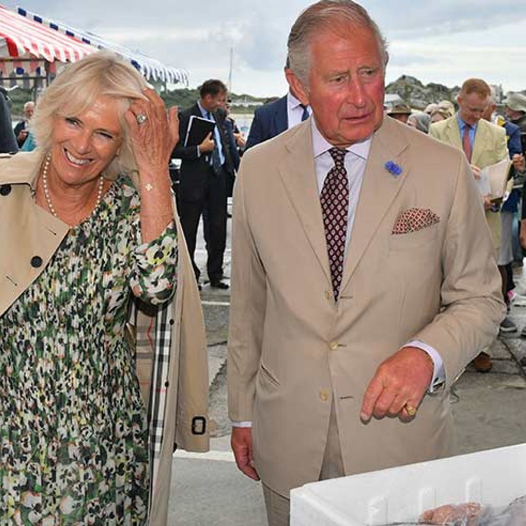 The Duchess of Cornwall looks amazing in a Burberry trench coat - and matches with Prince Charles!