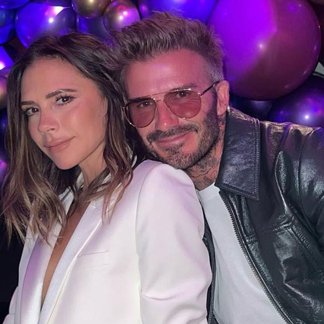 Victoria Beckham flashes a smile as cosies up to husband David Beckham in new photo