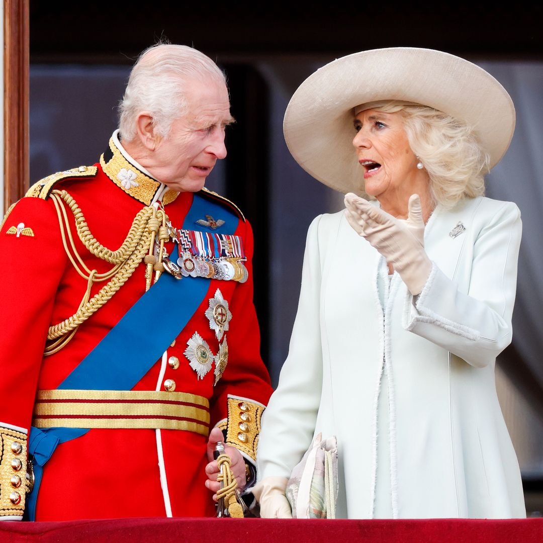 Queen Camilla's three-word exchange with King Charles after appearing to hurry him off the balcony at Trooping the Colour