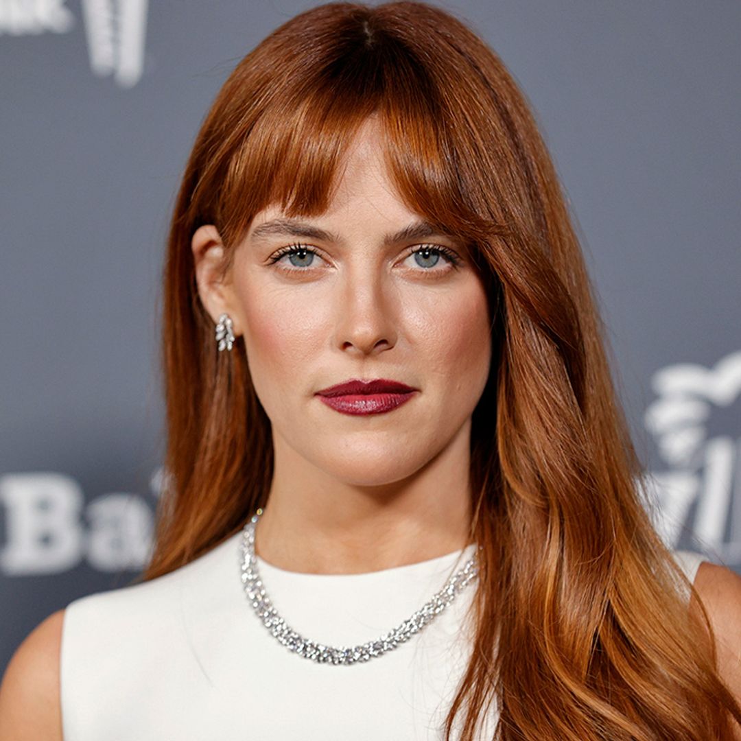 Riley Keough is a vision in slinky feathered cardigan and mini skirt