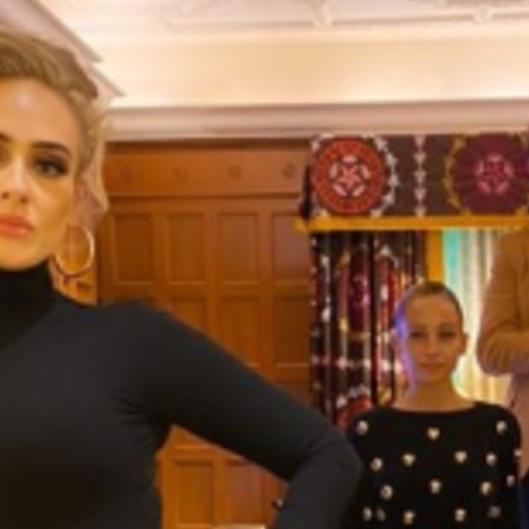 Adele shows off new figure in black mini dress