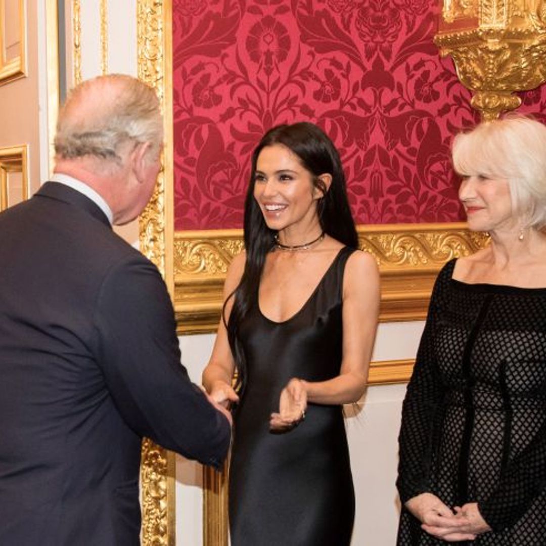 Cheryl stuns in sleek black gown as she joins Prince Charles at charity event