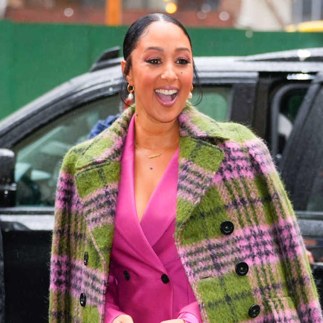 Tamera Mowry-Housley makes a statement in bold pink and royally chic earrings