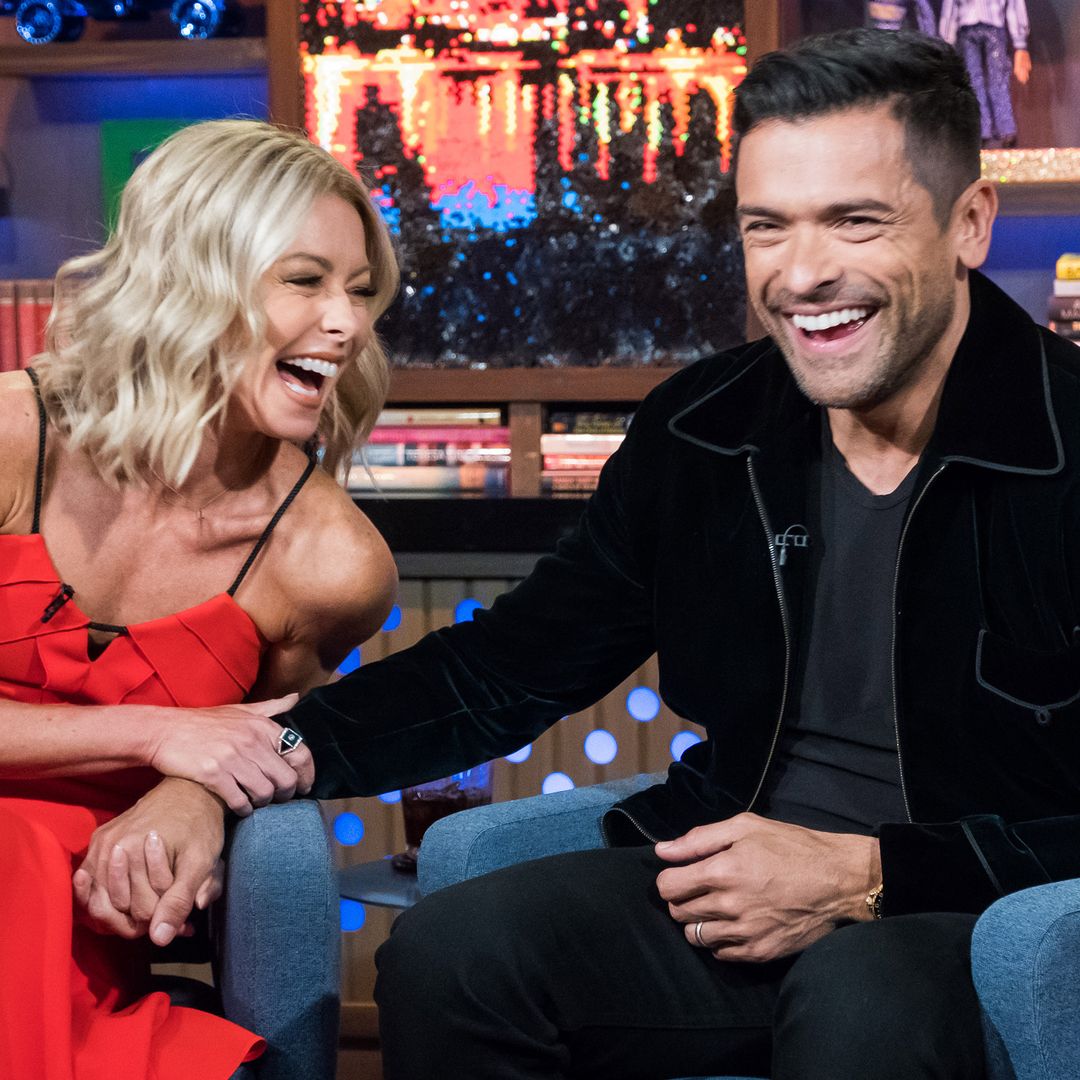 Kelly and Mark laughing on a talk show