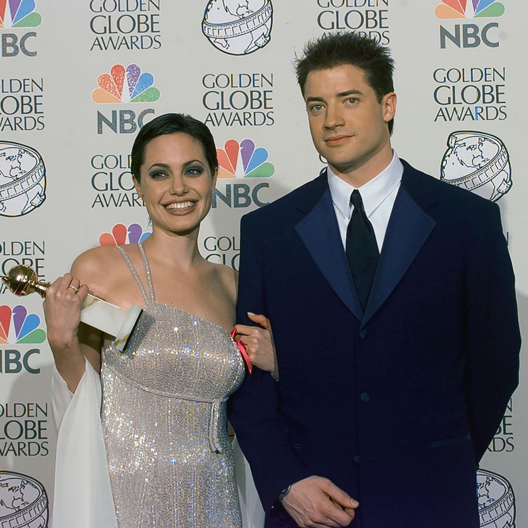 Angelina Jolie with Brendan Fraser backstage at Golden Globe Awards 1997 