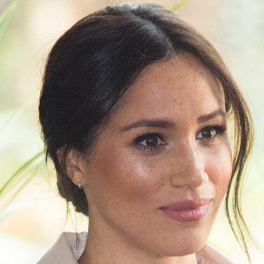 Meghan Markle tears up as she admits life in the spotlight is a struggle