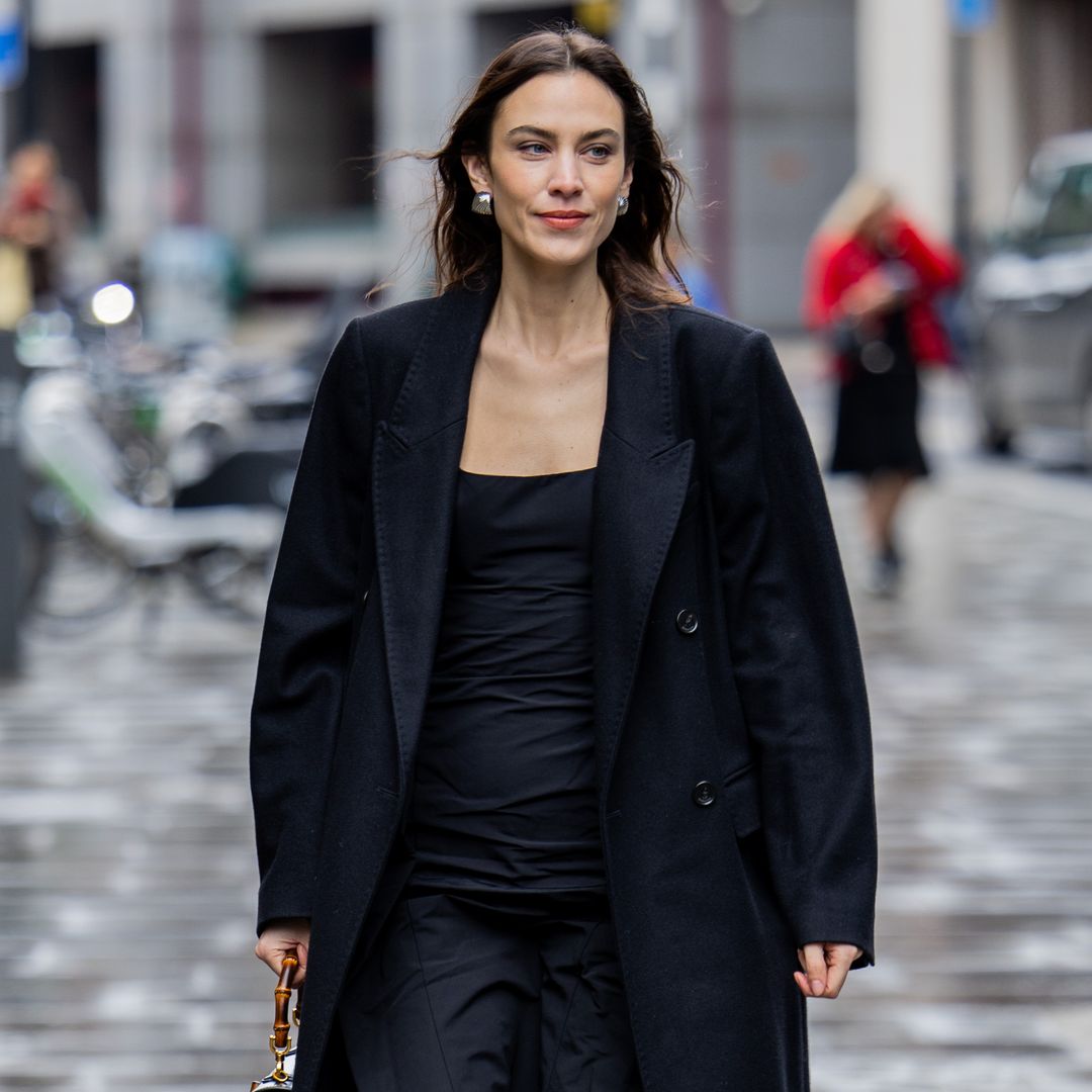 Alexa Chung nails school-girl chic in pleated skirt and knee-high boots