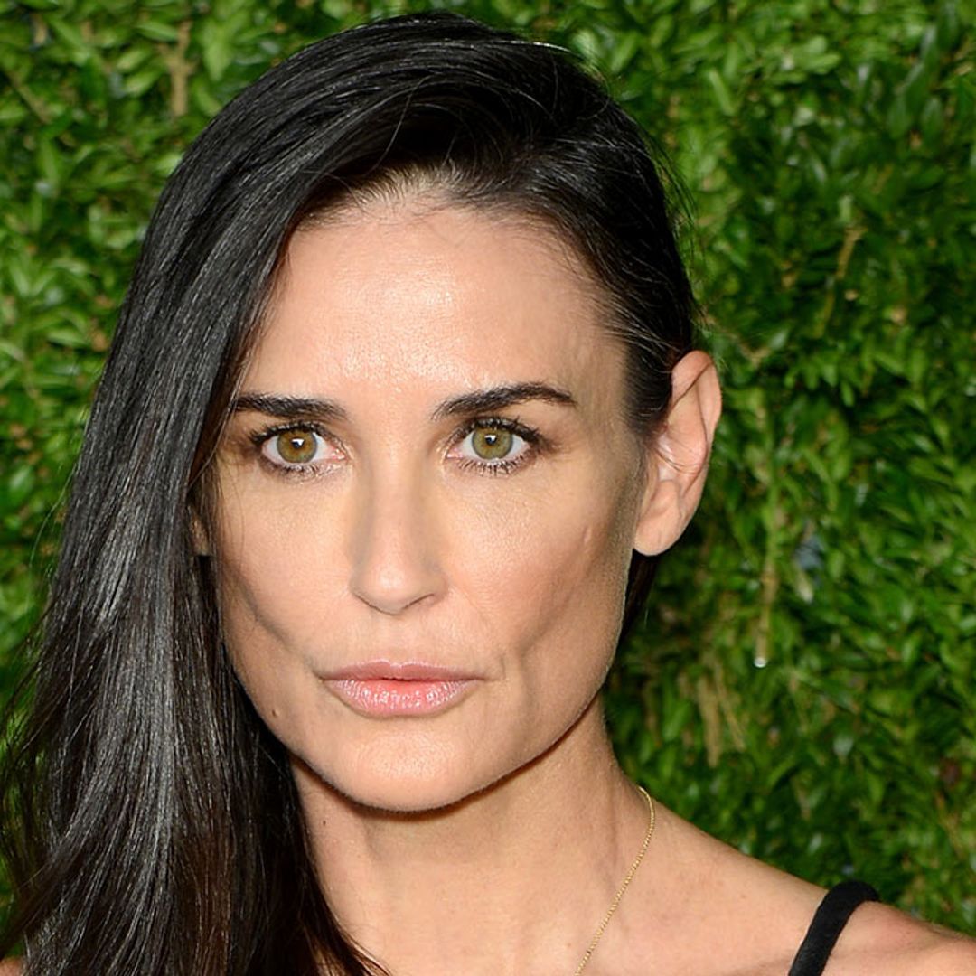 Demi Moore is age-defying as she poses in swimsuit alongside 'twin' daughters