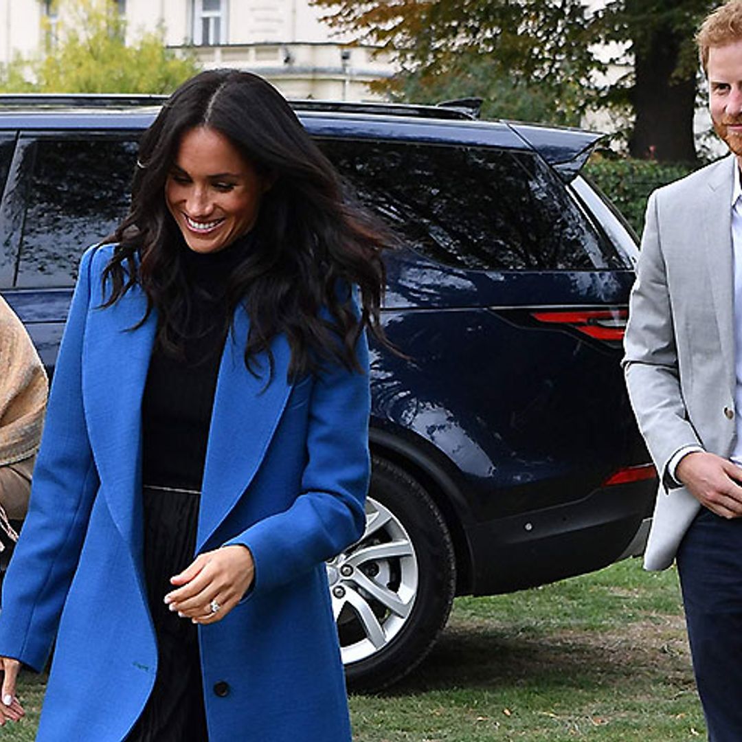 Duchess of Sussex avoids a wardrobe malfunction as she arrives at Grenfell book launch event
