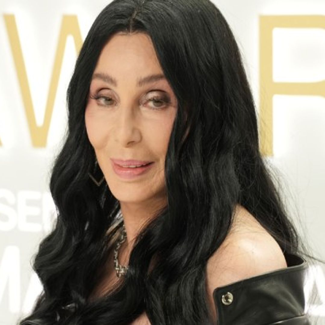Cher heats up 'Burlesque' red carpet in lacy black number