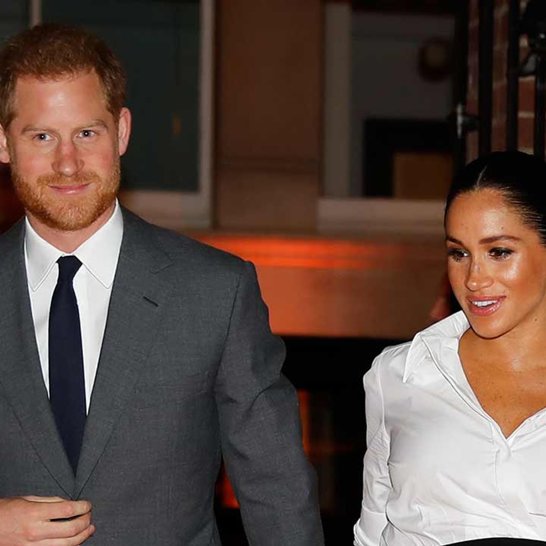 Prince Harry reveals Meghan Markle's carrying a heavy baby