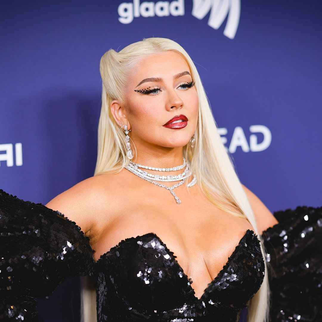 Christina Aguilera takes center stage in skintight lace-up leather catsuit