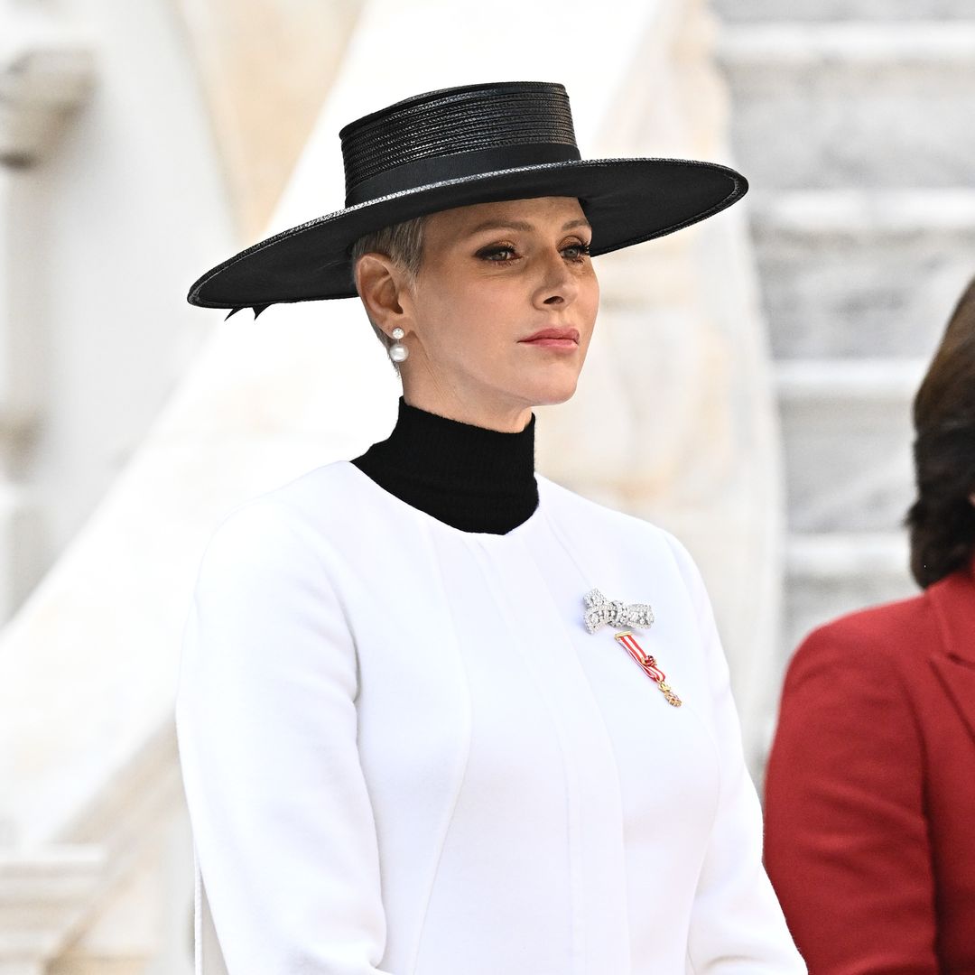 Princess Charlene exudes elegance in regal white coat and sky-high heels