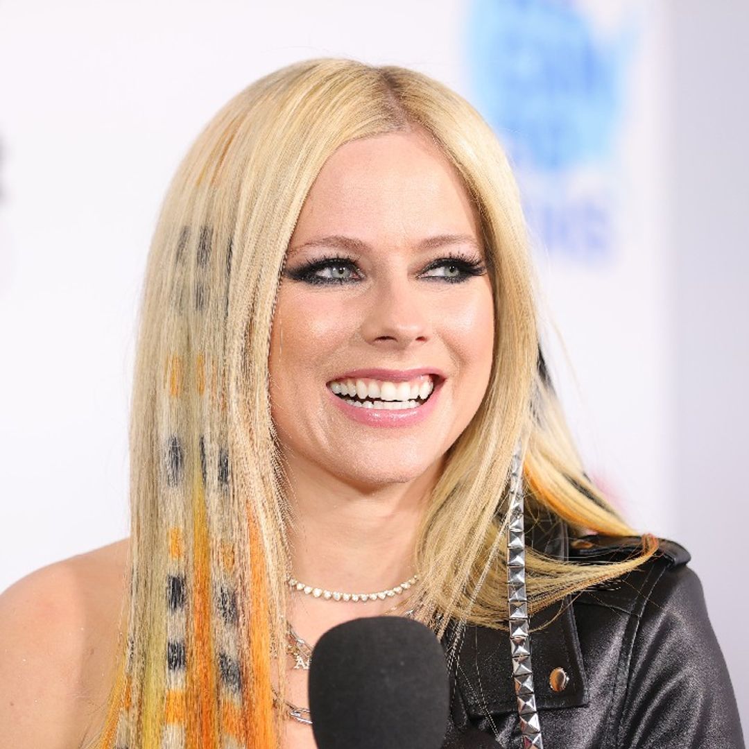 Avril Lavigne ditches her trademark stage look for new Versace jacket