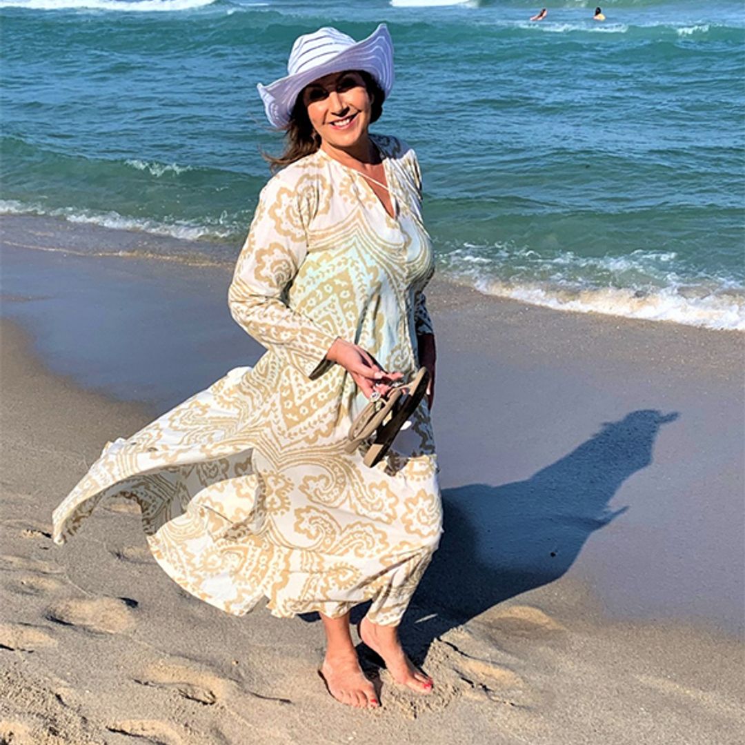 jane mcdonald wearing a patterned beach dress