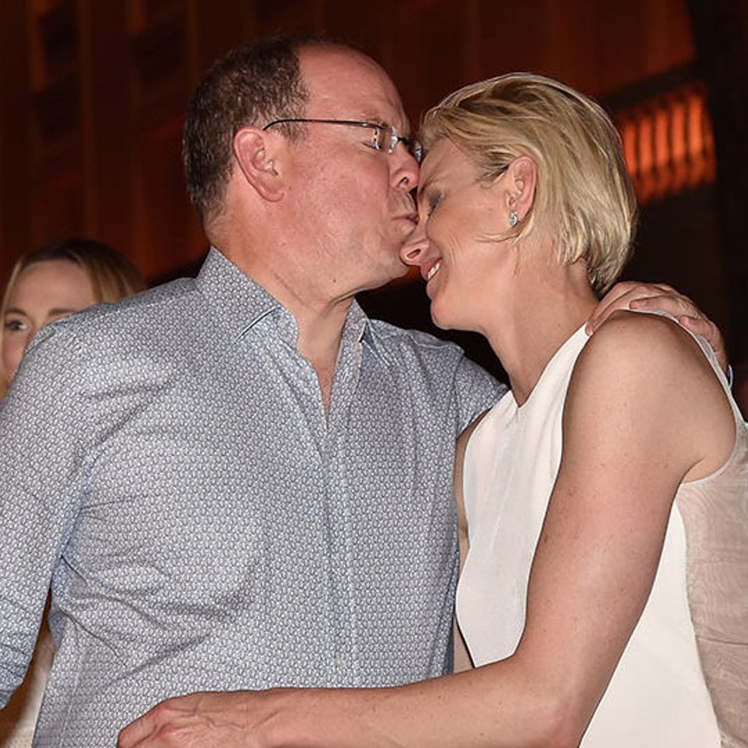 Prince Albert and Princess Charlene's PDA during Robbie Williams' concert