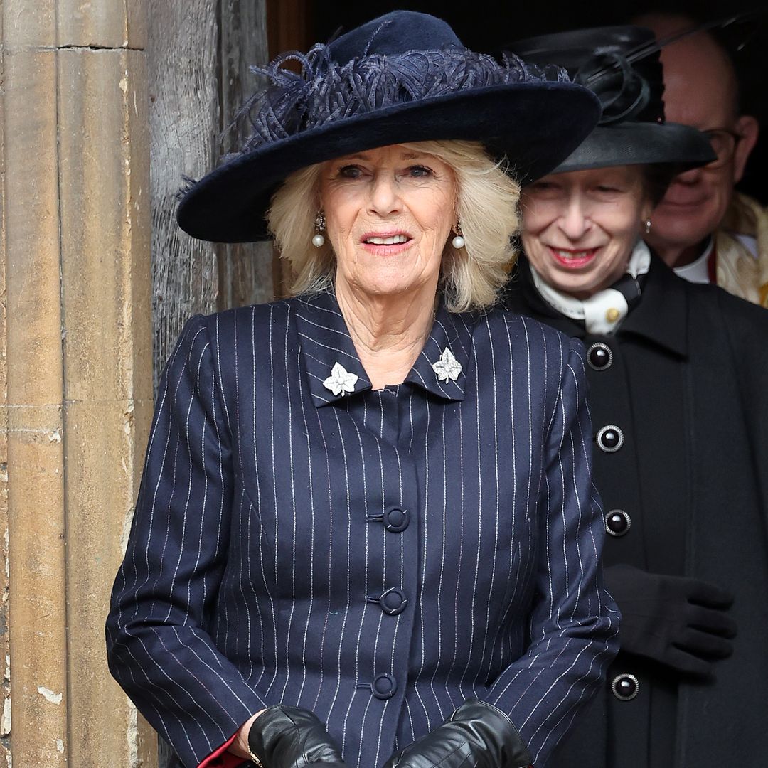 Queen Camilla looks refined in fit and flare pinstripes for Windsor family outing