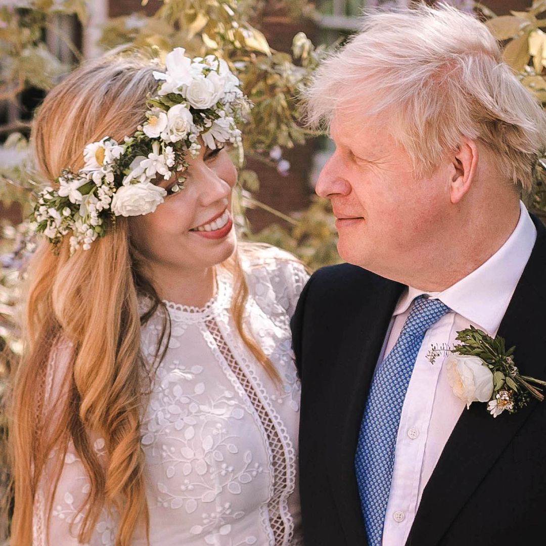 Boris Johnson's flower-clad bride Carrie grins in rare wedding photo