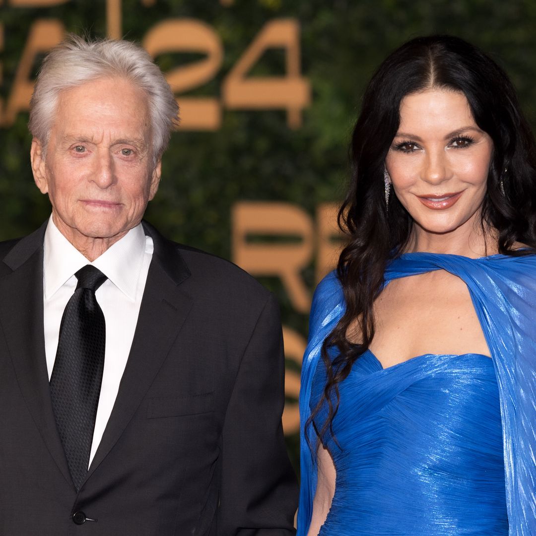 Catherine Zeta-Jones stuns in epic caped gown alongside Michael Douglas 