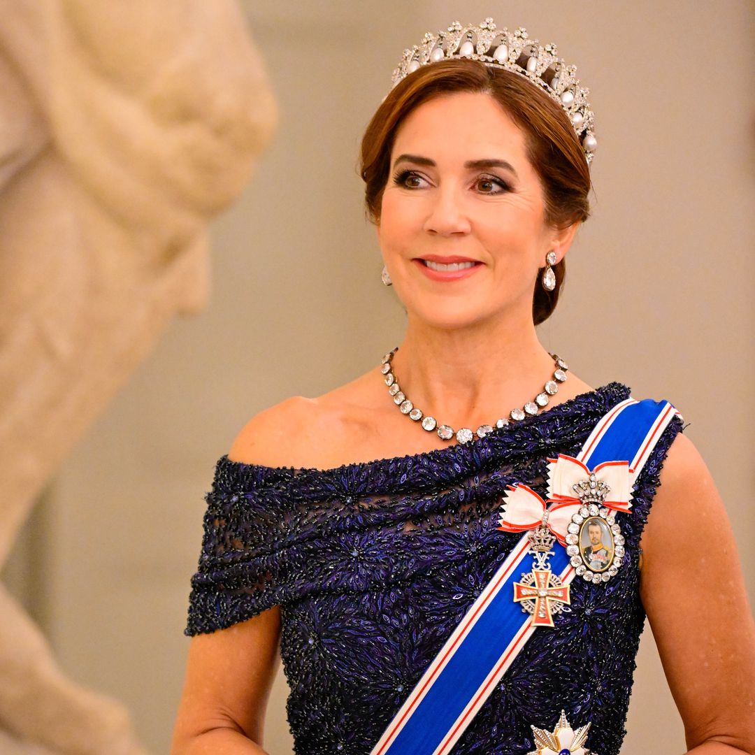 Queen Mary is mesmerising in Pearl Poire tiara and glittering gown