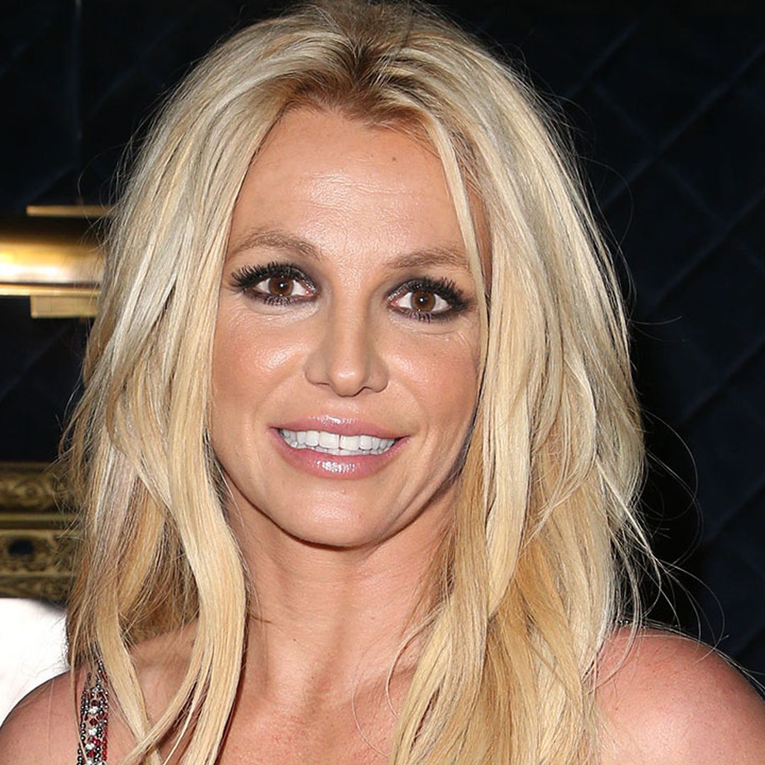 Britney Spears displays her amazing figure in plunging green dress
