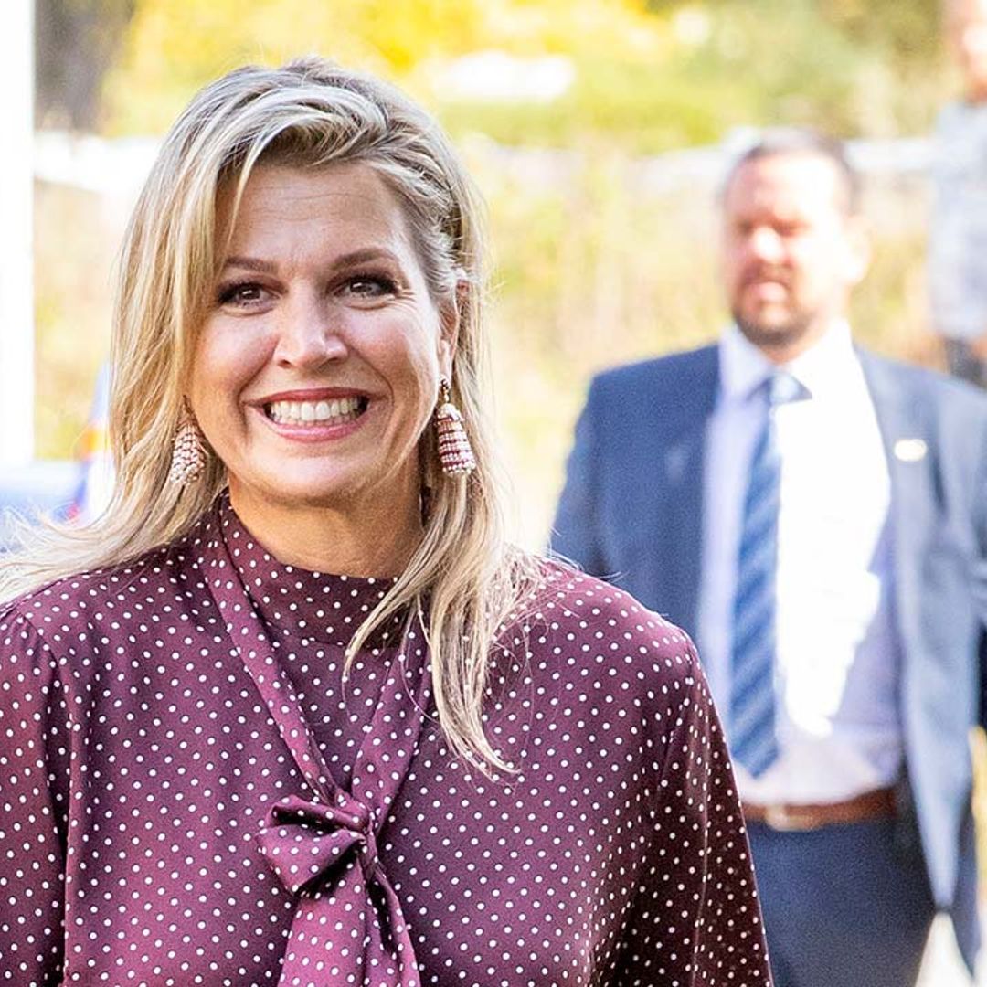 Magnificent in maroon! Queen Maxima steps out in leather for an official engagement