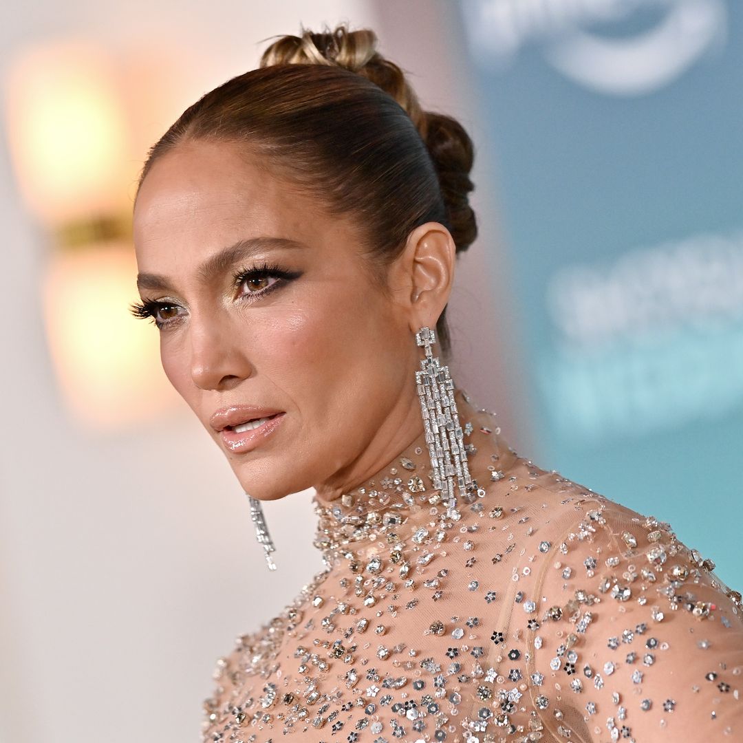 Jennifer Lopez is a vision in slinky gown and seriously killer boots