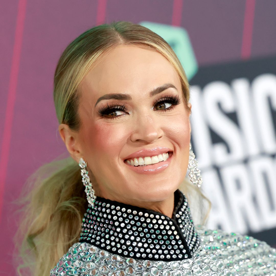 Carrie Underwood rocks tiny metallic shorts as she shares head-turning new photos