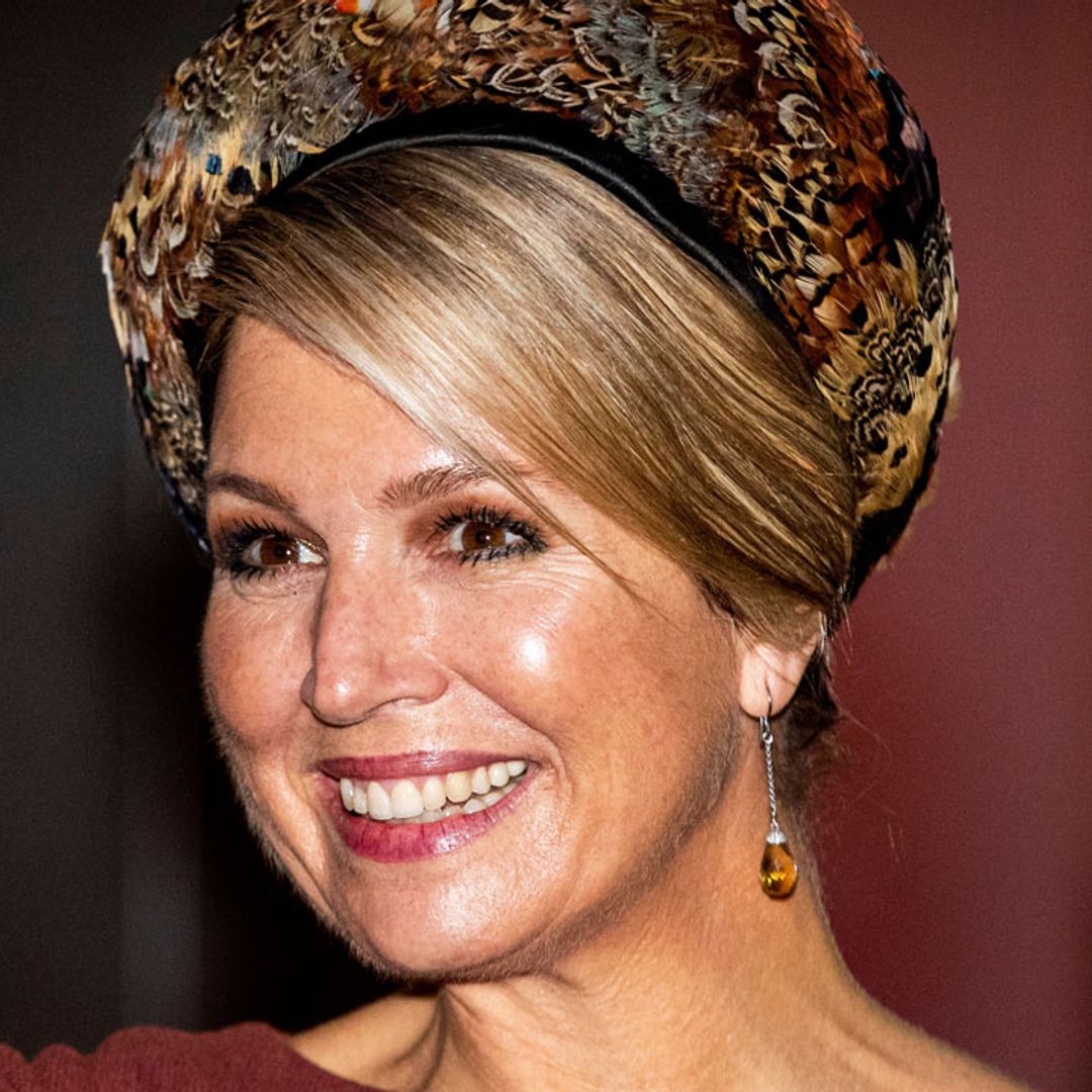 Queen Maxima's statement feathered headband would be perfect for a wedding