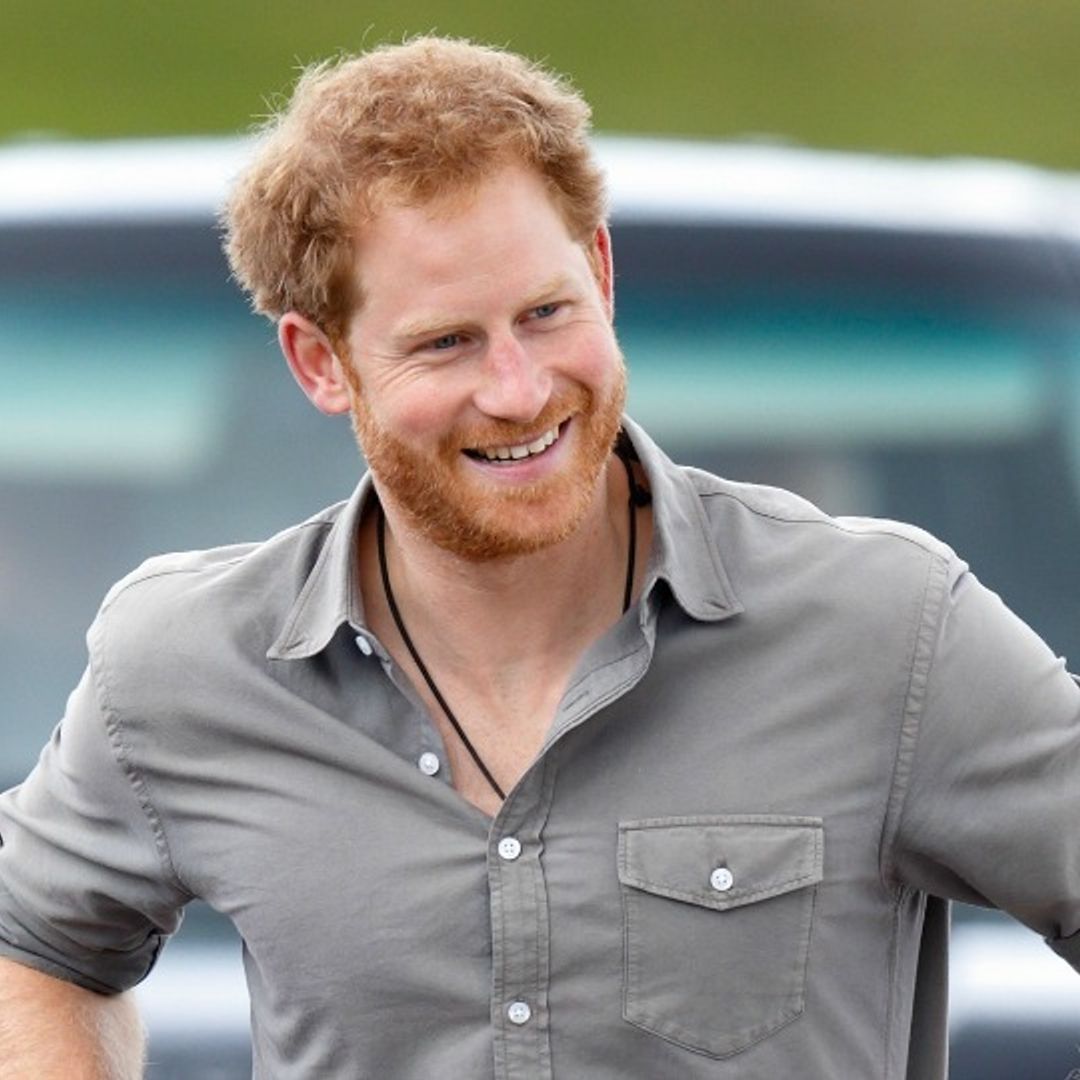 Prince Harry politely declines a kiss from a woman after being serenaded during his nonstop day