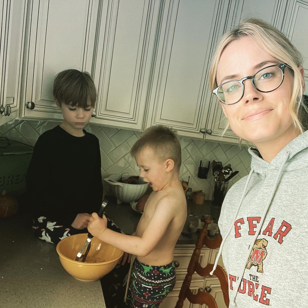 Abigail Hawk and her two sons bake at home, shared on Instagram