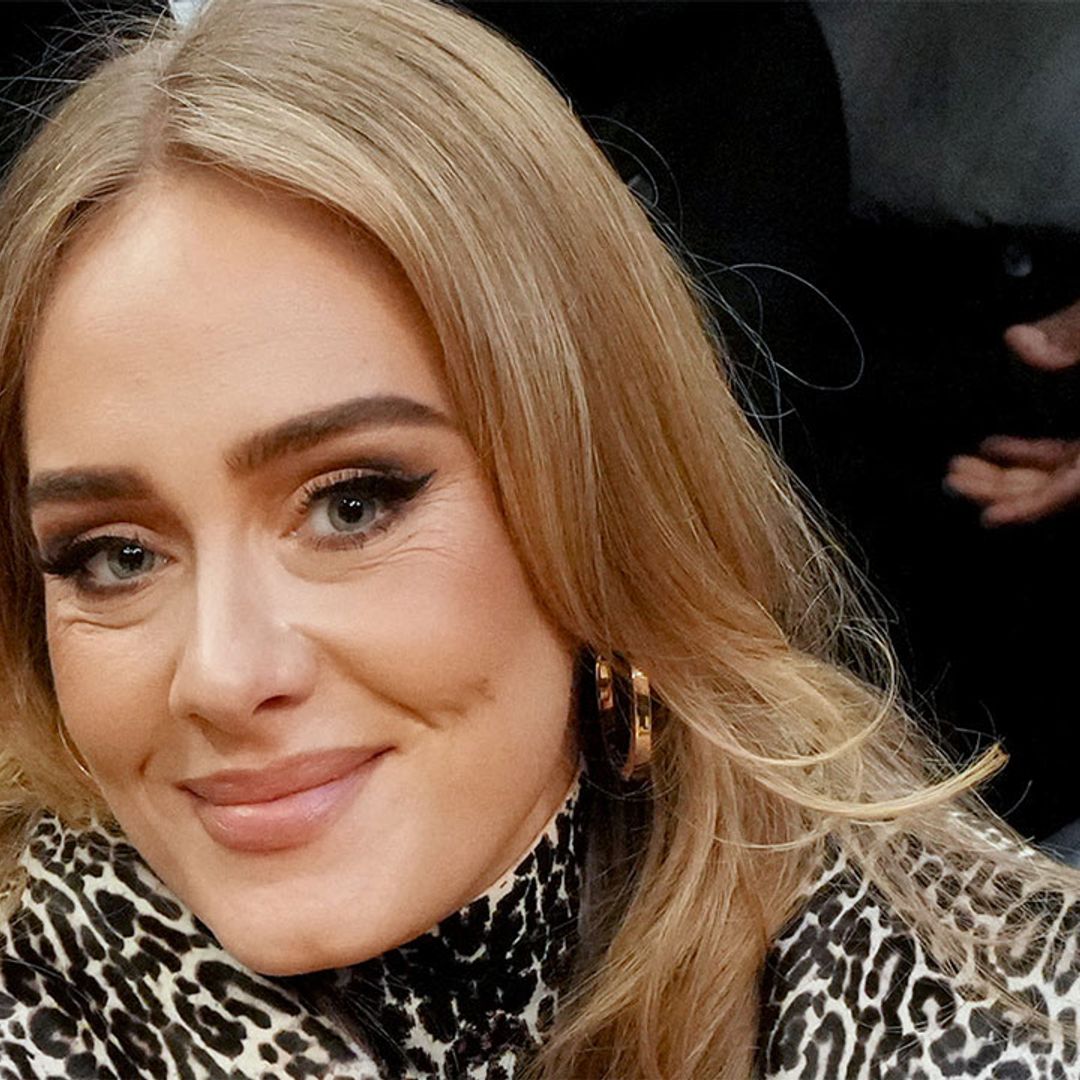 Adele cosies up to boyfriend in an outfit that will seriously astound you