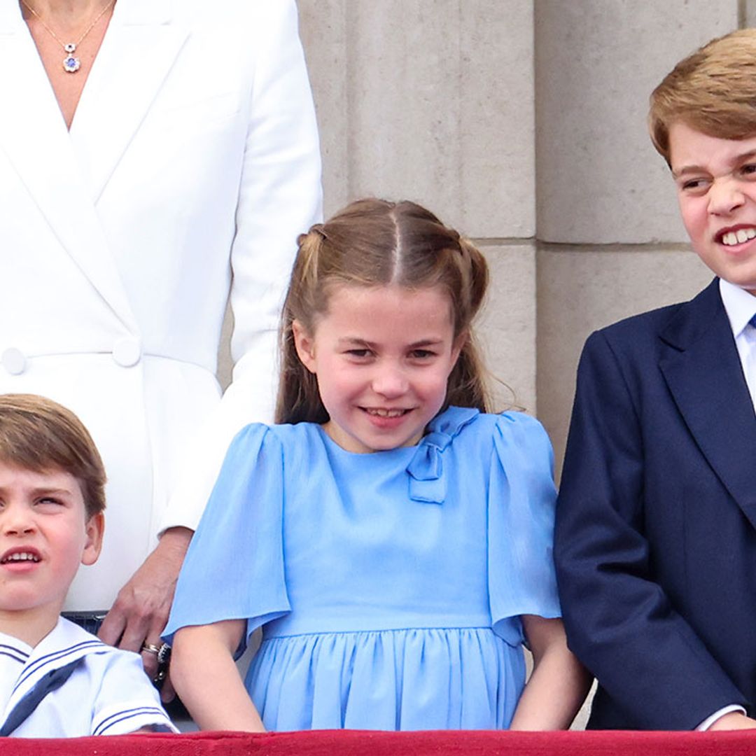 Kate Middleton and her children George, Charlotte and Louis bow their heads at Trooping the Colour
