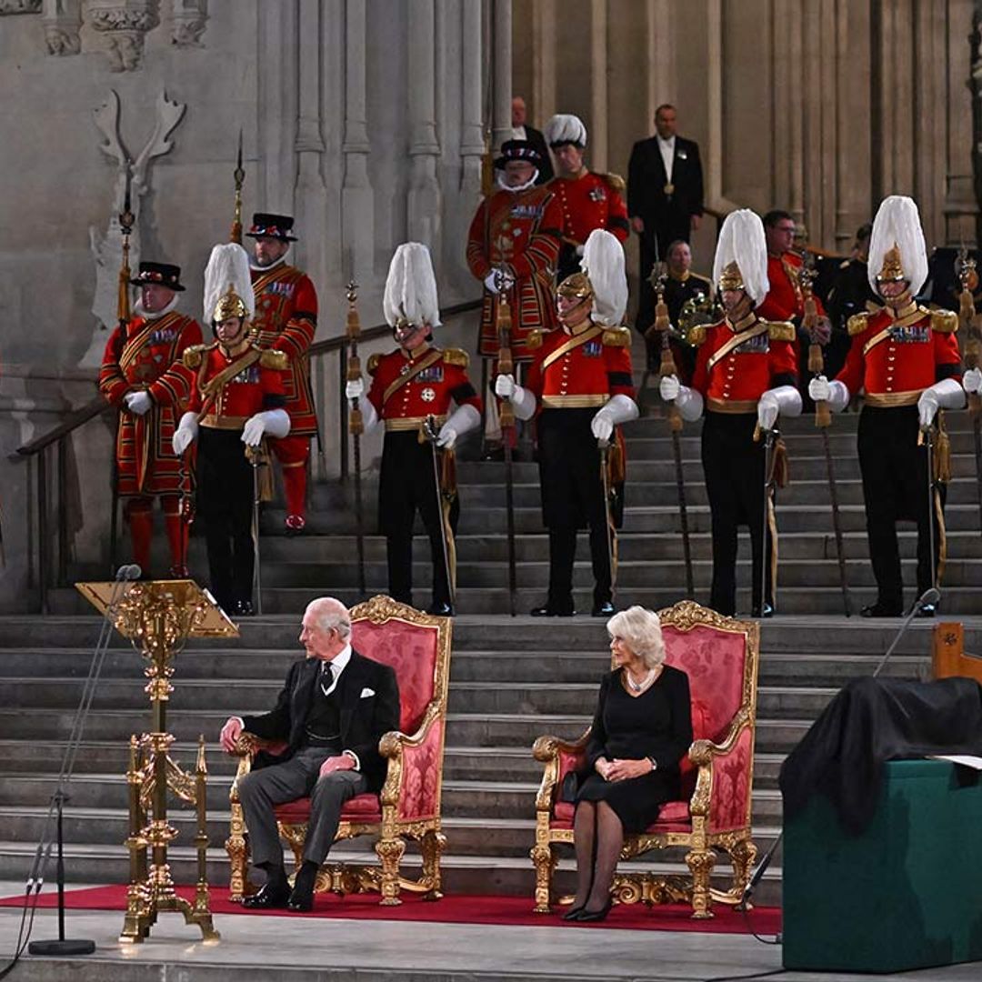 King Charles III takes the throne with the Queen Consort next to him in Parliament