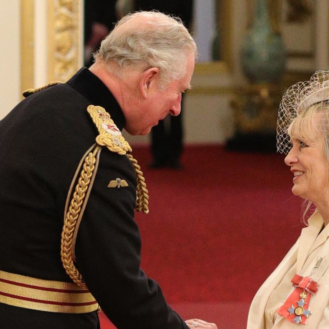 Dame Twiggy! Iconic fashion model accepts her new title at Buckingham Palace in striking white tuxedo