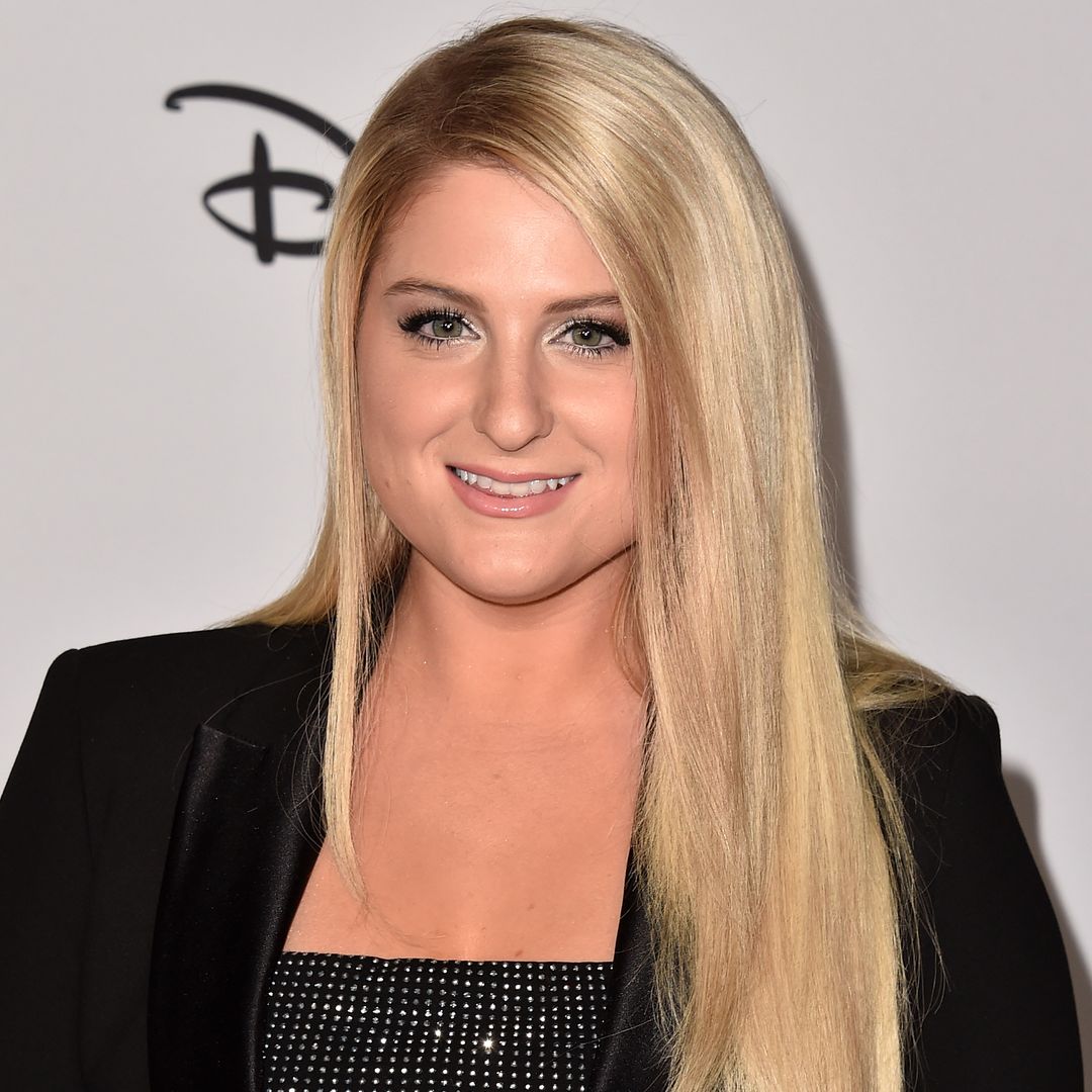 Meghan Trainor is glowing in tiny mini dress and leg lengthening heels as she talks post-partum body