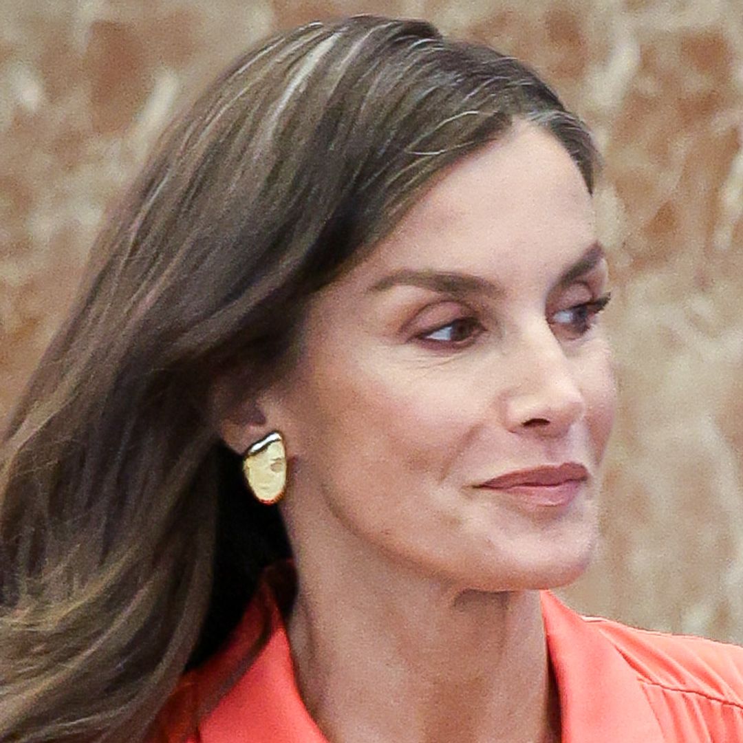 Queen Letizia oozes 'flamboyance' in silky Barbie pink and leather